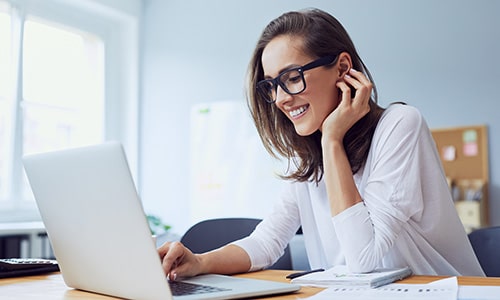 A woman adminitrating training on a computer